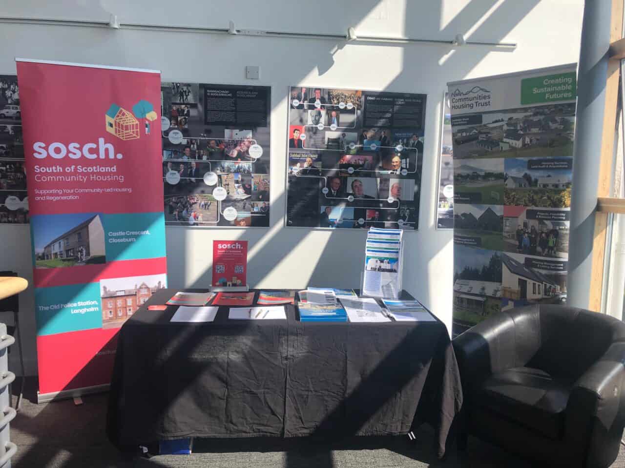 Conference display table laid out with flyers at Community Land Scotland Conference
